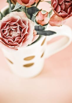 cup full of pink roses