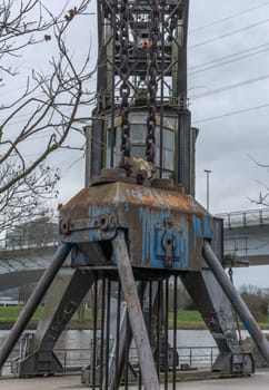Industrial monument coal crane on the banks of the main river of Frankfurt-Hoechst