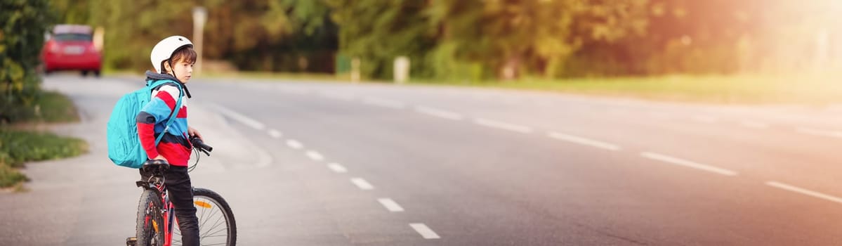 Teenager in the morning hurrying on bicycle to the lesson. Concept of the back to school.