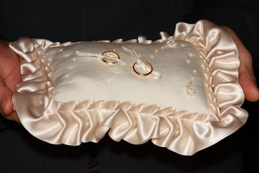 Wedding rings on a cushion