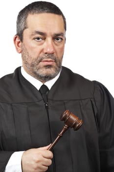 A serious male judge holding the gavel, isolated on white background