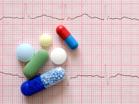 Macro of pills lying on ECG diagram