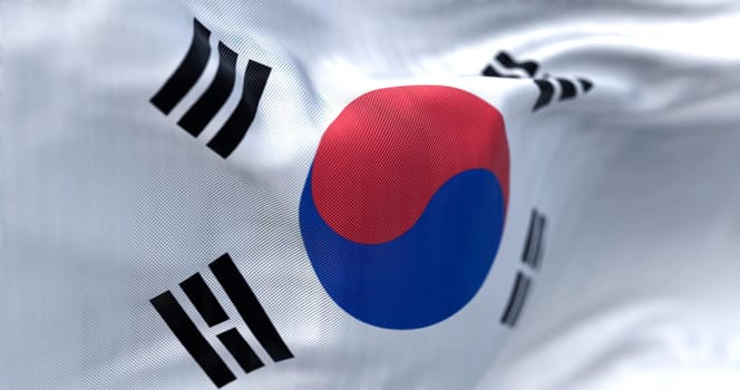 Close-up view of the South Korea national flag waving. The flag is a white field with a red and blue taegeuk in the center. Fabric textured background. Selective focus. Realistic 3d illustration