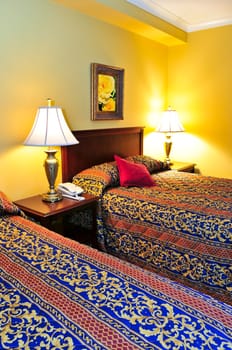 Bedroom interior with two double beds, images on the wall are my own.