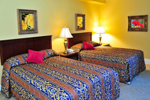 Bedroom interior with two double beds, images on the wall are my own.