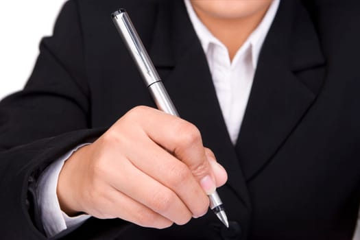 A hand holding a pen is about to give signature.