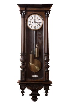 Old pendulum wall clock isolated on white.