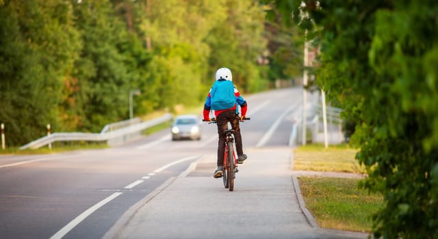 Teenager in the morning hurrying on bicycle to the lesson. Concept of the back to school.
