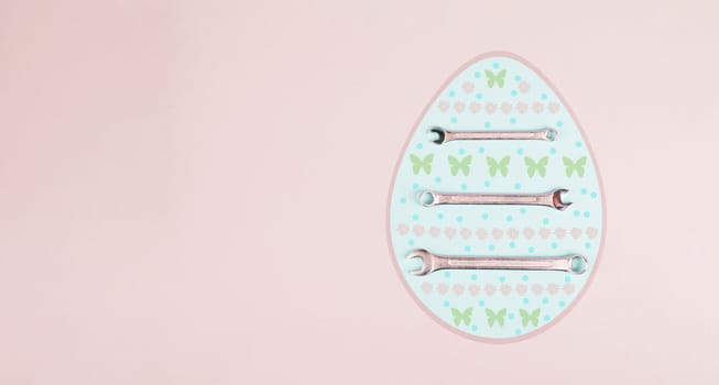 Easter egg with wrenches and butterflies, holiday greeting card with repair tools, spring season