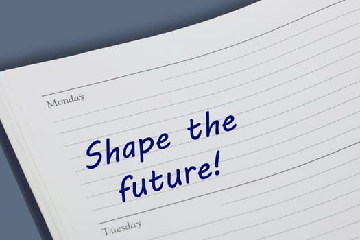A Shape the future reminder message open on desk