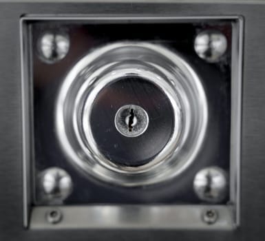 Keyholes. close up detail modern round metal key hole steel door, security safety protect