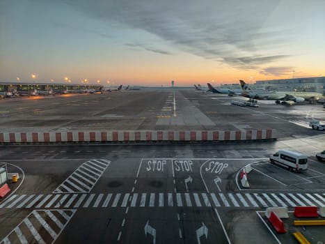 Zaventem, Belgium, December 2022: Early morning sunrise on the tarmac of Brussels Airport