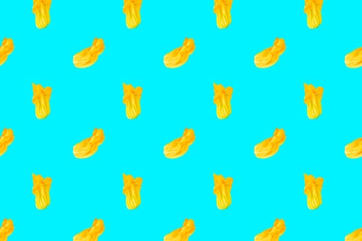 Seamless pattern. Yellow flower of zucchini or pumpkin on colored background. Packaging concept. Full depth of field.