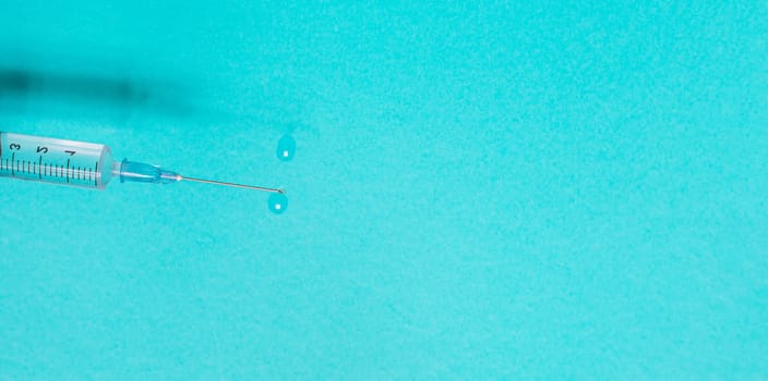 Vaccination debate concept. Biotechnology banner with medical syringe. Copyspace for text. flatlay.