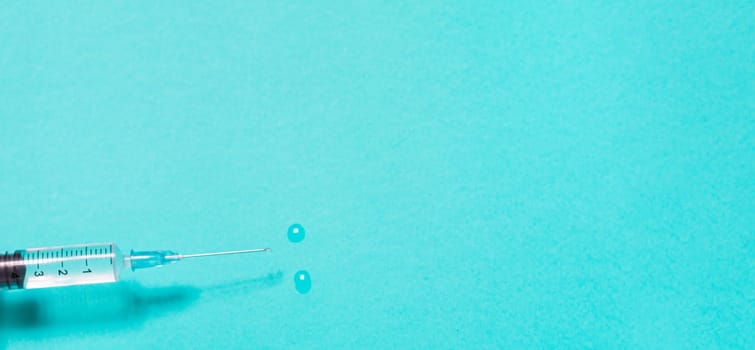 Vaccination debate concept. Biotechnology banner with medical syringe. Copyspace for text. flatlay.