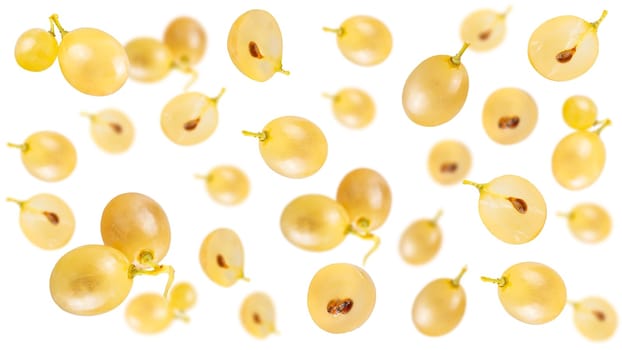 Creative levitation seamless pattern with many ripe grapes on a pastel pink, selective focus.