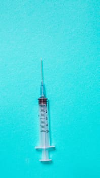 Vaccination debate concept. Biotechnology banner with medical syringe. Copyspace for text. flatlay.
