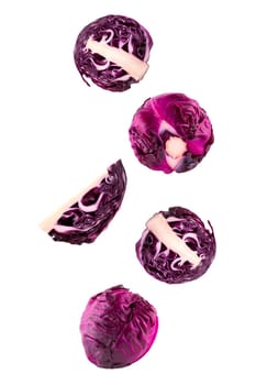 Isolated flying vegetables. Five whole and sliced red chicory falling on white with clipping path as package design element and advertising. Full depth of field.