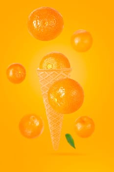 Falling ice cream cone with mandarin fruits. Seven flying whole tangerines on colored table with clipping path as package design element and advertising. Selective focus.