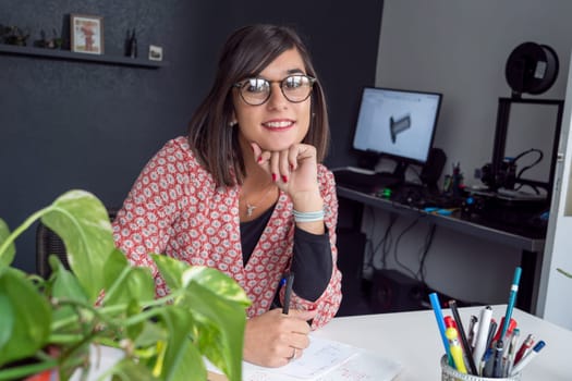 smiling young brunette working at home