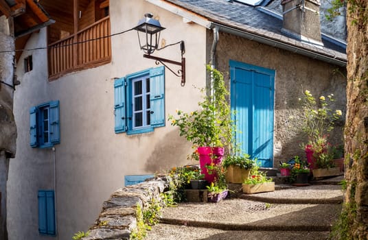 typical street of a french village with flowers