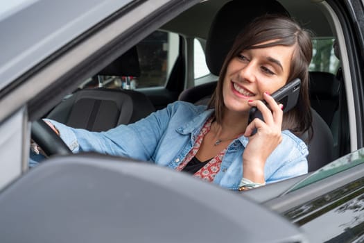 Woman use mobile phone in a car