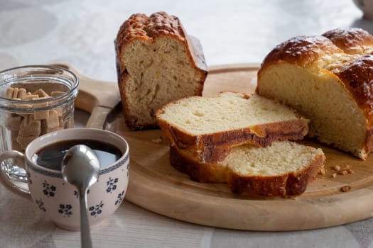 a cup of coffee and homemade brioche