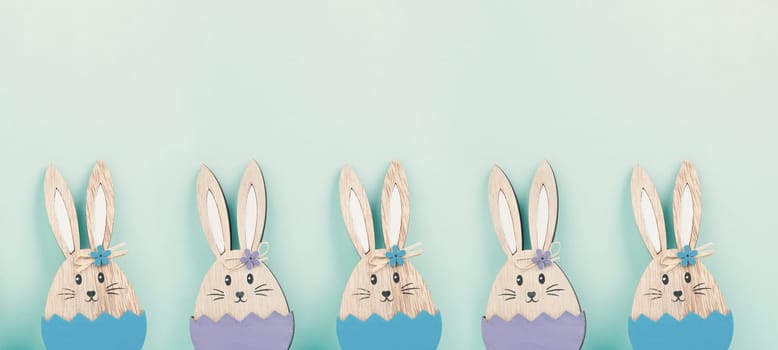 Panoramic easter holiday greeting card with cute bunnies, rabbits in spring, banner or header