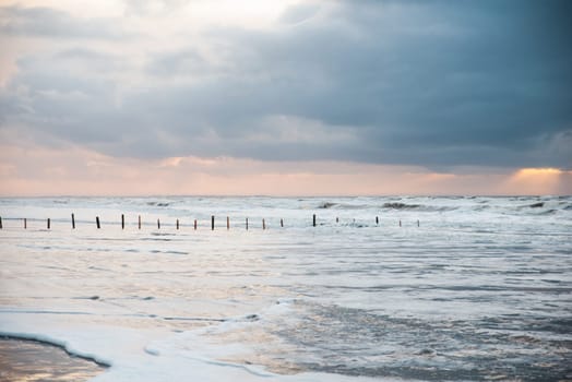 Wadden sea at low tide, North sea beach landscape, coast on Romo island in Denmark at sunset, vacation und lifestyle