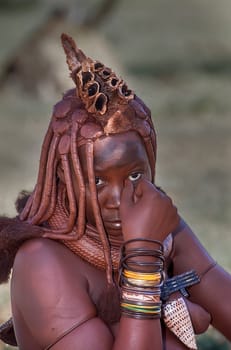 May 15, 2005. portrait of unidentified Himba woman  with the traditional hairstyle, necklace and the typical ochre tinted skin. Epupa Falls, Kaokoland or Kunene Province, Namibia, Africa