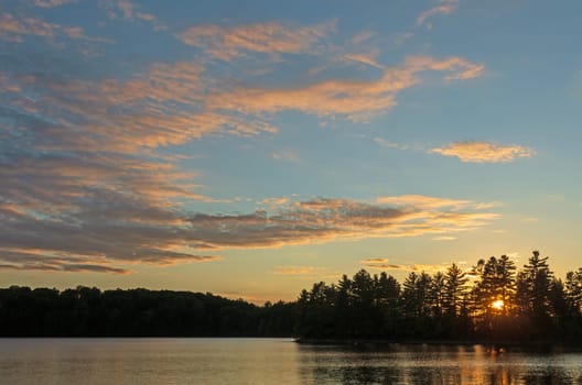 Evening Sun Peeking Through the Trees on Clark Lake in the Sylvania Wilderness in Michigan