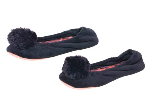 Slippers isolated. Close-up of a pair of black female house slippers isolated on a white background. Woman shoes.