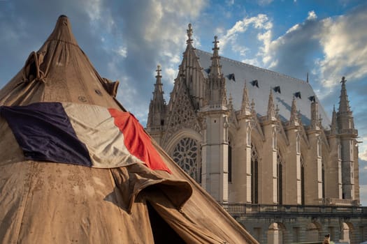 a french flag and church