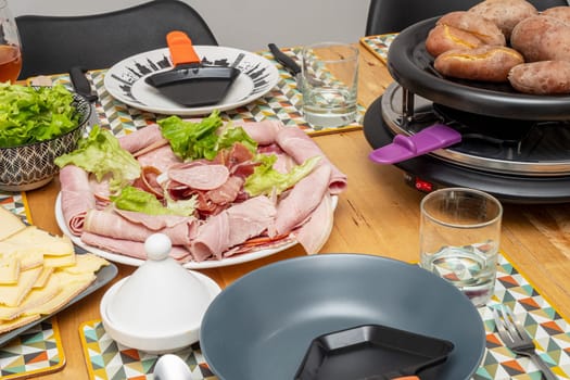 Raclette cheese and meat, a french tradition