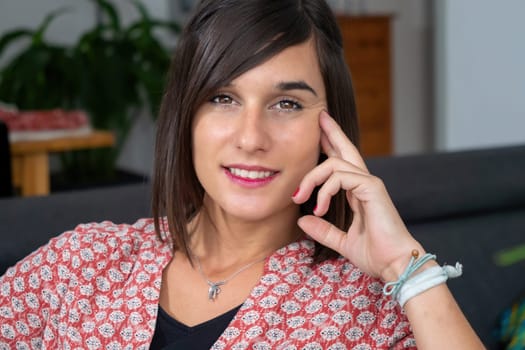 Portrait of a young brunette woman smiling