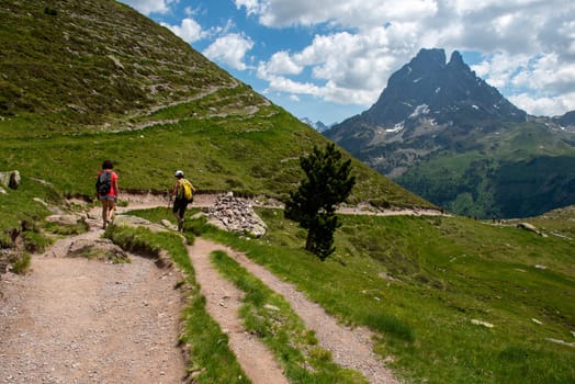Two hiker women in path of Pic du Midi Ossau in the French Pyrenees mountains