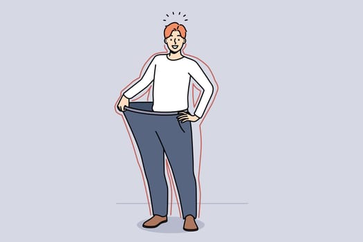 Smiling young man in loose pants show results of diet. Happy slim guy demonstrate nutrition result and weight loss. Vector illustration.