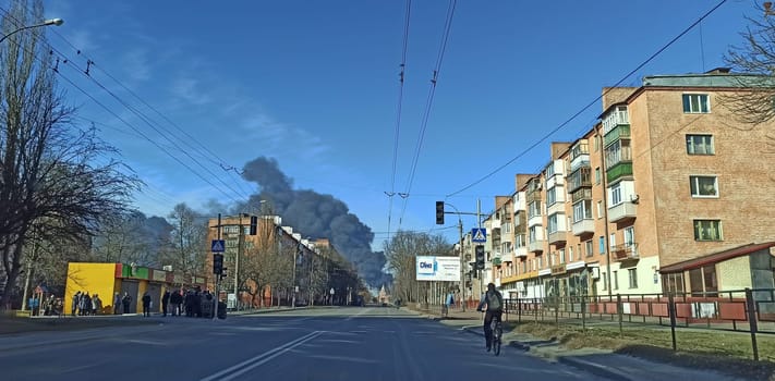 Smoke from fire in Chernihiv city after an air strike by Russian aircraft on the city. Horrors of war in Ukraine. Black smoke against sky. Fire during the war. Henocid