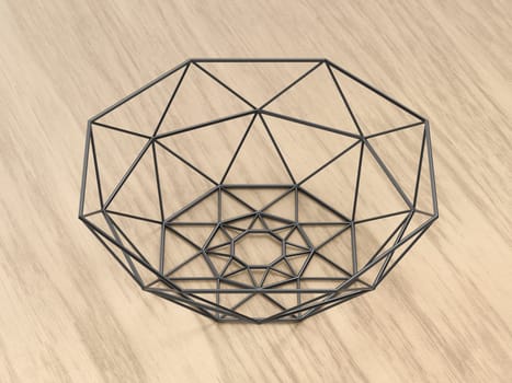 Black metal mesh fruit bowl on wooden table