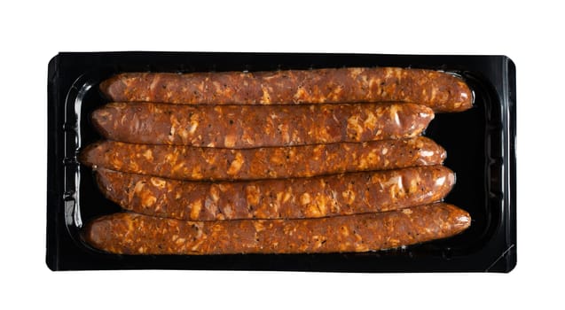 top view of smoked salami sausages in transparent vacuum plastic black packaging isolated on white