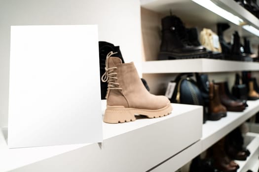 perspective view of point of sale empty shelf sign poster holder mockup in retail shoe store window