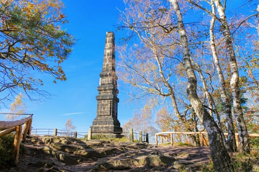 Obelisk an mountain Lilienstein in Elbe sandstone mountains in autumn, Germany
