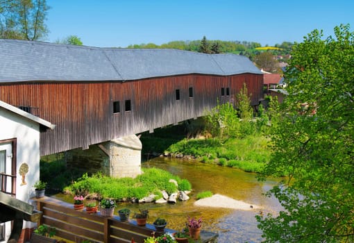 Wuenschendorf in the Vogtland over the Elster river, historic covered wooden bridge