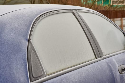 frozen windshield of a passenger car in winter. High quality photo