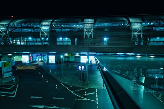 Low angle shot of DUS Airport and Skytrain at night in Duesseldorf, Germany