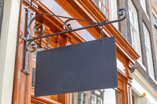 Empty signboard on the wall of an old building ready for your use. Horizontally.
