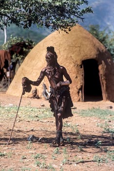 May 15, 2005.Himba village. unidentified Himba women with the traditional hairstyle, necklace and the typical ochre tinted skin. Epupa Falls, Kaokoland or Kunene Province, Namibia, Africa