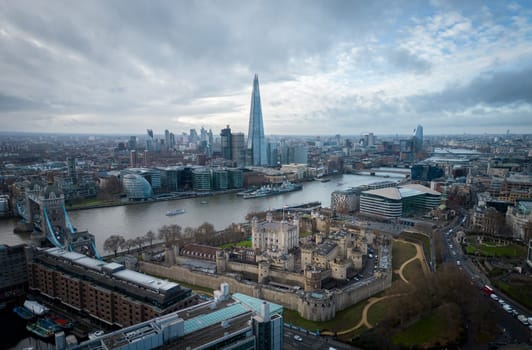 The Tower of London from above with a view over the city - LONDON, UNITED KINGDOM - DECEMBER 20, 2022
