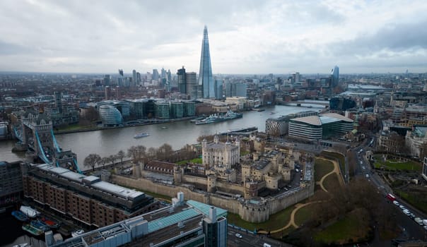 The Tower of London from above with a view over the city - LONDON, UNITED KINGDOM - DECEMBER 20, 2022