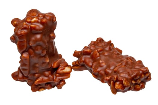 Chocolate candy with nuts isolated on a white background. Clipping path. Almond and nut slivers embedded in milk chocolate.
